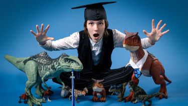 ADHD senior photo session with dinosaurs in studio